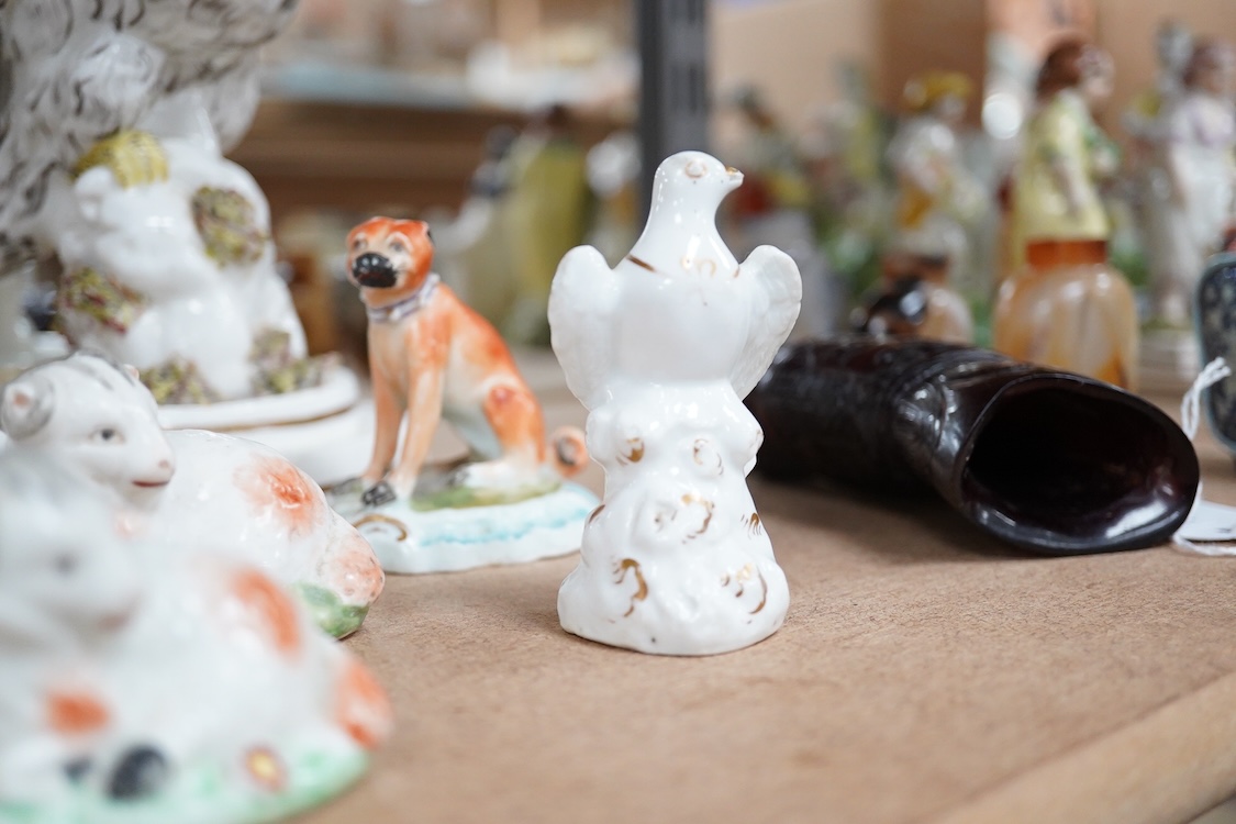 A rare Staffordshire porcelain model of an eagle or vulture, c.1830-50, and five Derby porcelain models, 1810–30; two recumbent sheep, a pug dog, a deer and a dove, 20cm high